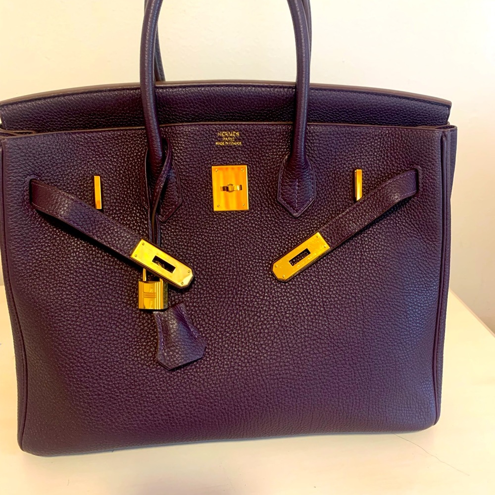 Beautiful birkin bag .Rasin color with gold hard ware.Excellent contition